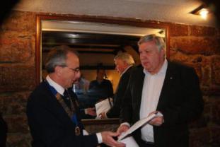 Lion President Twiggy Lake welcoming Lion Mike Mitchell to the Club